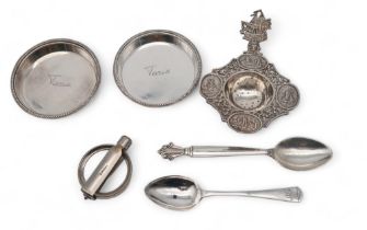 A Dtuch silver strainer spoon, a Georg Jensen acanthus pattern teaspoon, another silver teaspoon,