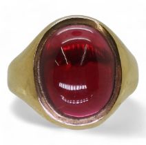 A red glass set 9ct gold signet ring, size approx N1/2, weight 6.4gms Condition Report:Available