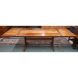 A mid 20th century Scandinavian Skovby teak tile topped extending dining table with drop ends on