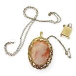 A 9ct gold cameo pendant brooch, together  with a 40cm chain and yellow metal prayer charm, weight