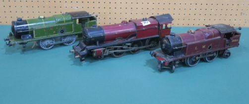 A Hornby 0-gauge 4-6-0 Royal Scot locomotive, a 4-4-2 locomotive with tender in LMS livery and an