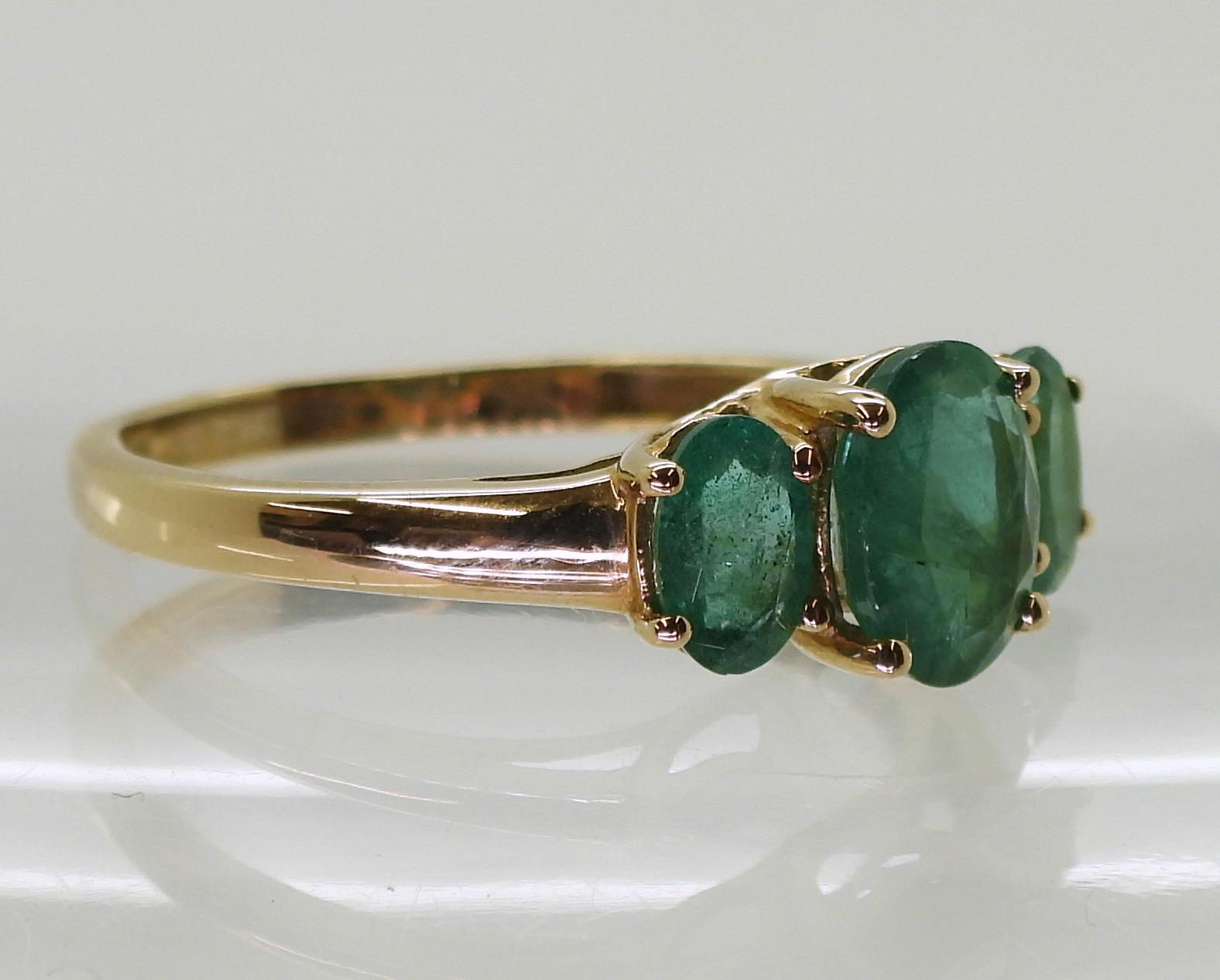 A 9ct gold emerald three stone ring, size T, weight 2.4gms Condition Report:Available upon request - Image 3 of 4