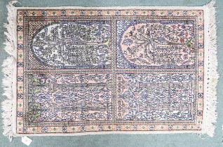 A multicoloured ground "100% silk" Kashmir rug with tree of life design within narrow border, 94cm