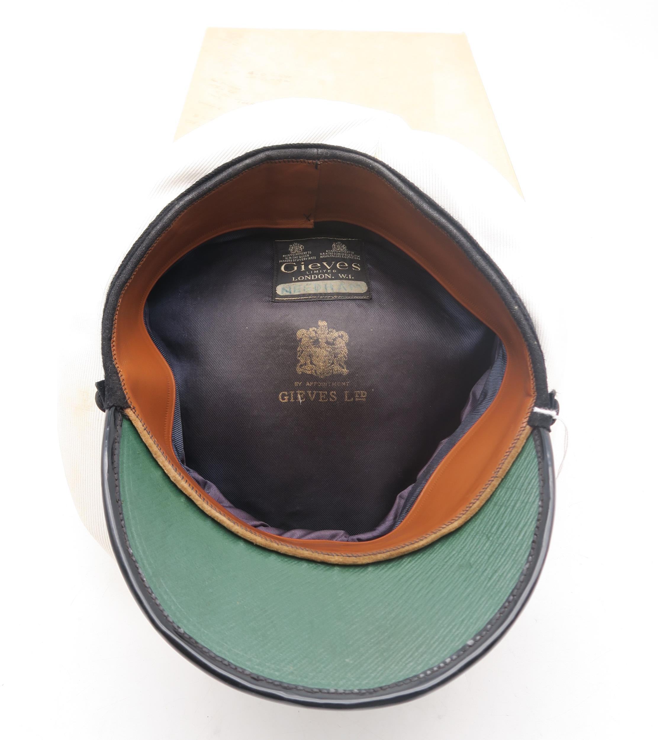 A post-War Royal Navy officer's cap by Gieves Ltd. of London, with bullion oak leaf embroidery to - Image 2 of 2