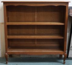 A 20th century oak open bookcase on cabriole supports, 97cm high x 99cm wide x 32cm deep Condition