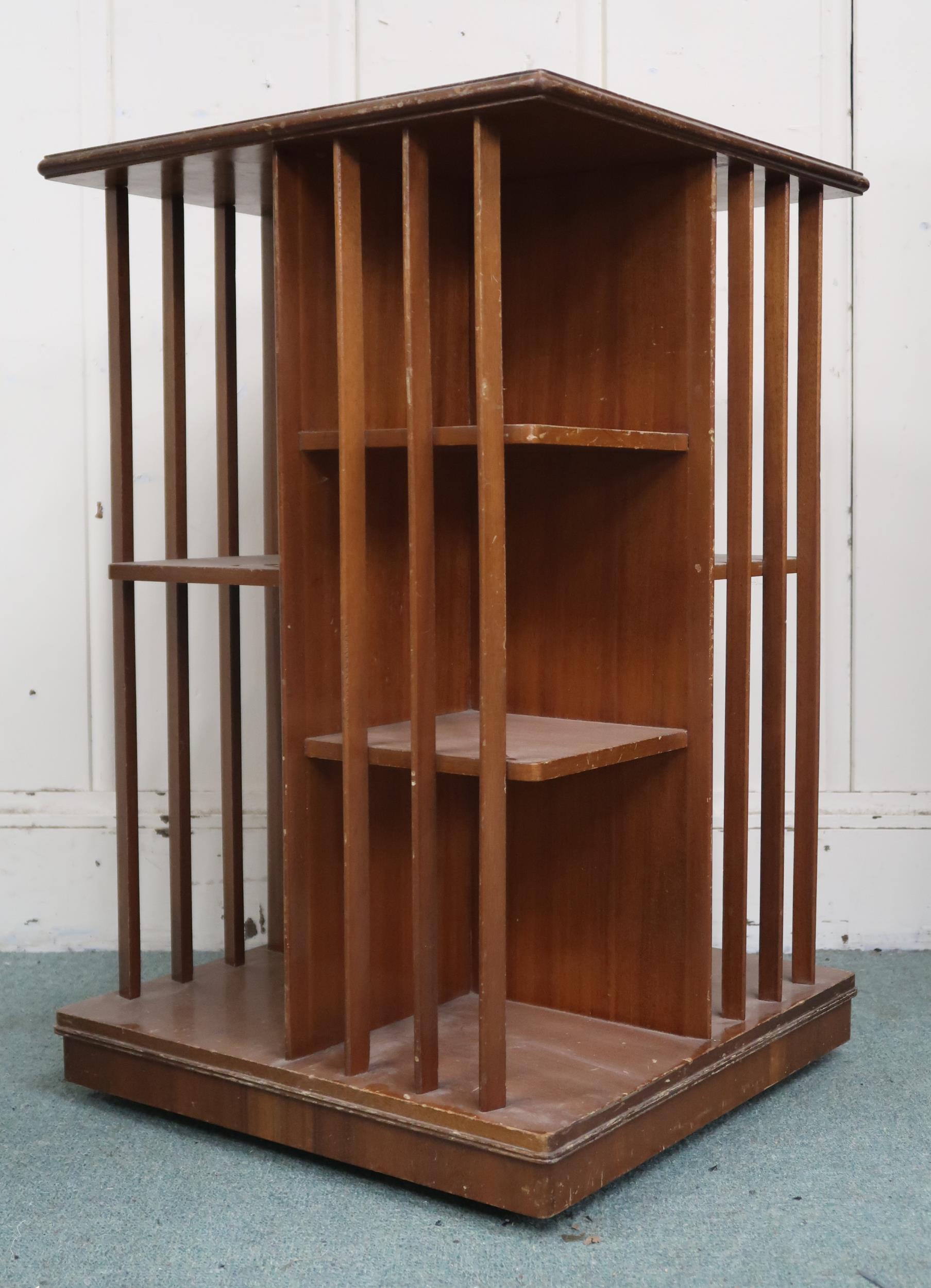 An early 20th century mahogany revolving bookcase with square top over asymmetrical shelves with - Image 2 of 3