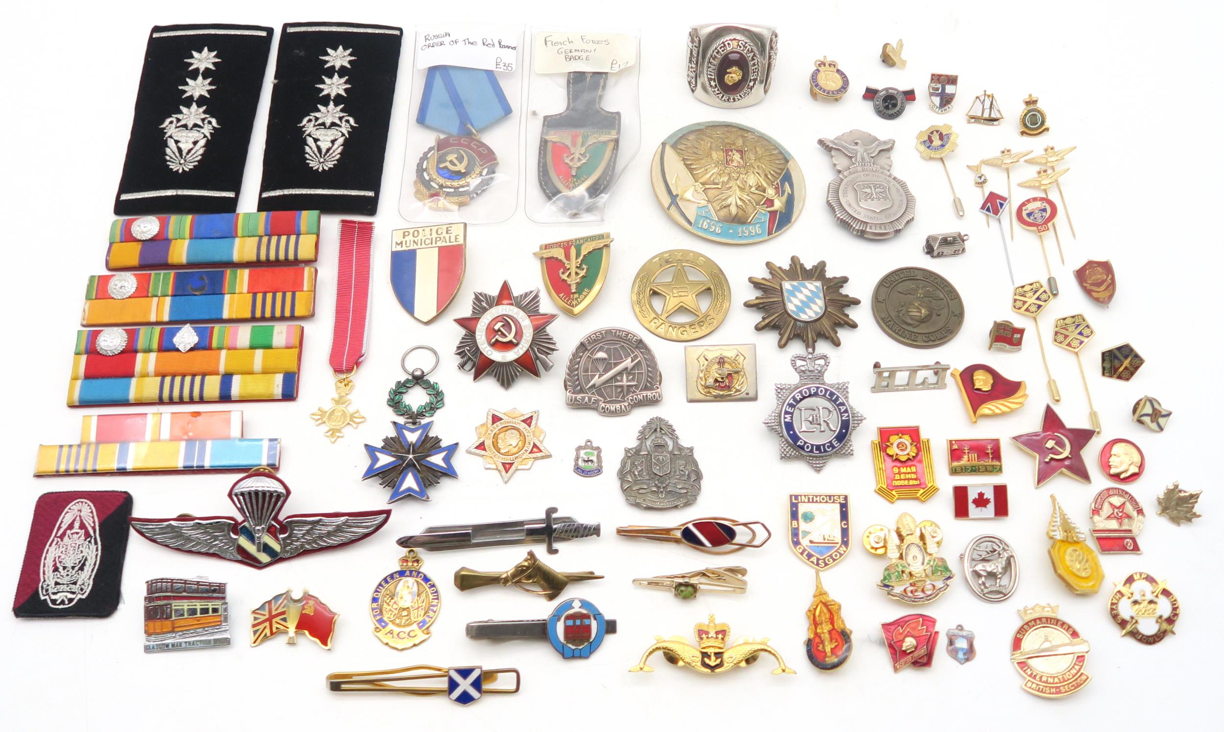 Assorted military medals and badges, to include a French Order of the Black Star medal; Russian
