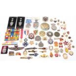 Assorted military medals and badges, to include a French Order of the Black Star medal; Russian
