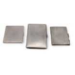 A silver cigarette case by Francis Howard Ltd, and two others, Birmingham marks, all with engine-