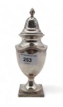 An Edwardian silver caster, London 1905,  of baluster form, with a wrythen knop, 196gms Condition