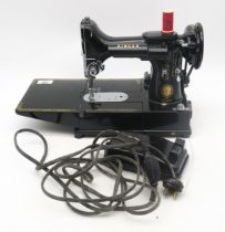 A Singer 222K sewing machine, with case, pedal and accessories; together with a cased Everay High
