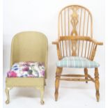 A lot comprising 20th century beech Windsor style rail back armchair and a Lloyd Loom bedroom