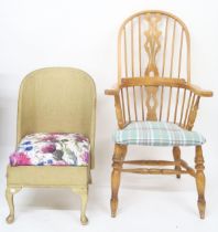 A lot comprising 20th century beech Windsor style rail back armchair and a Lloyd Loom bedroom