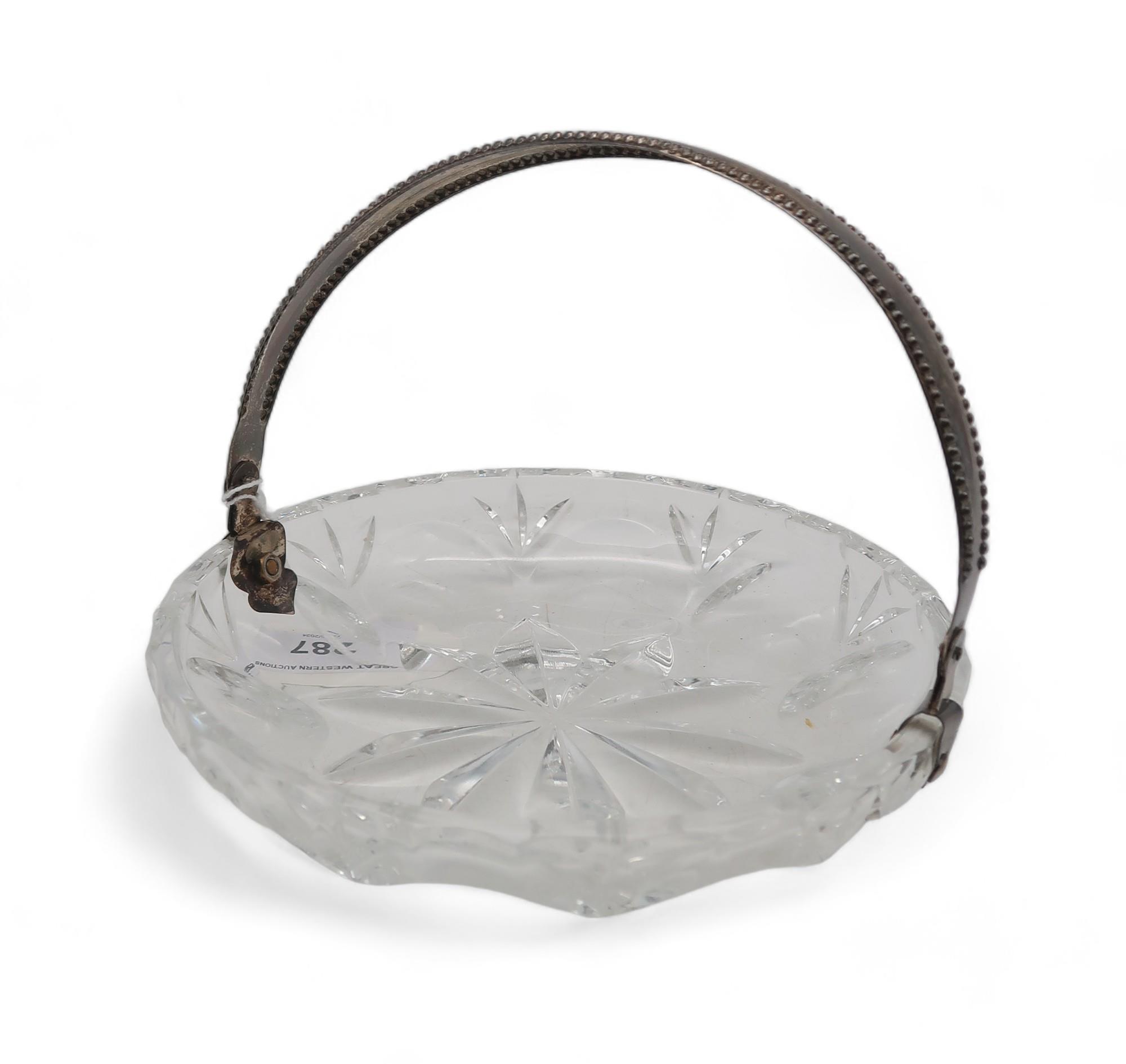 A silver cut glass swing handled basket Condition Report:Available upon request