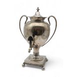 A Victorian silver plated tea urn, of neo-classical form, with engraved ribbon swags, with an