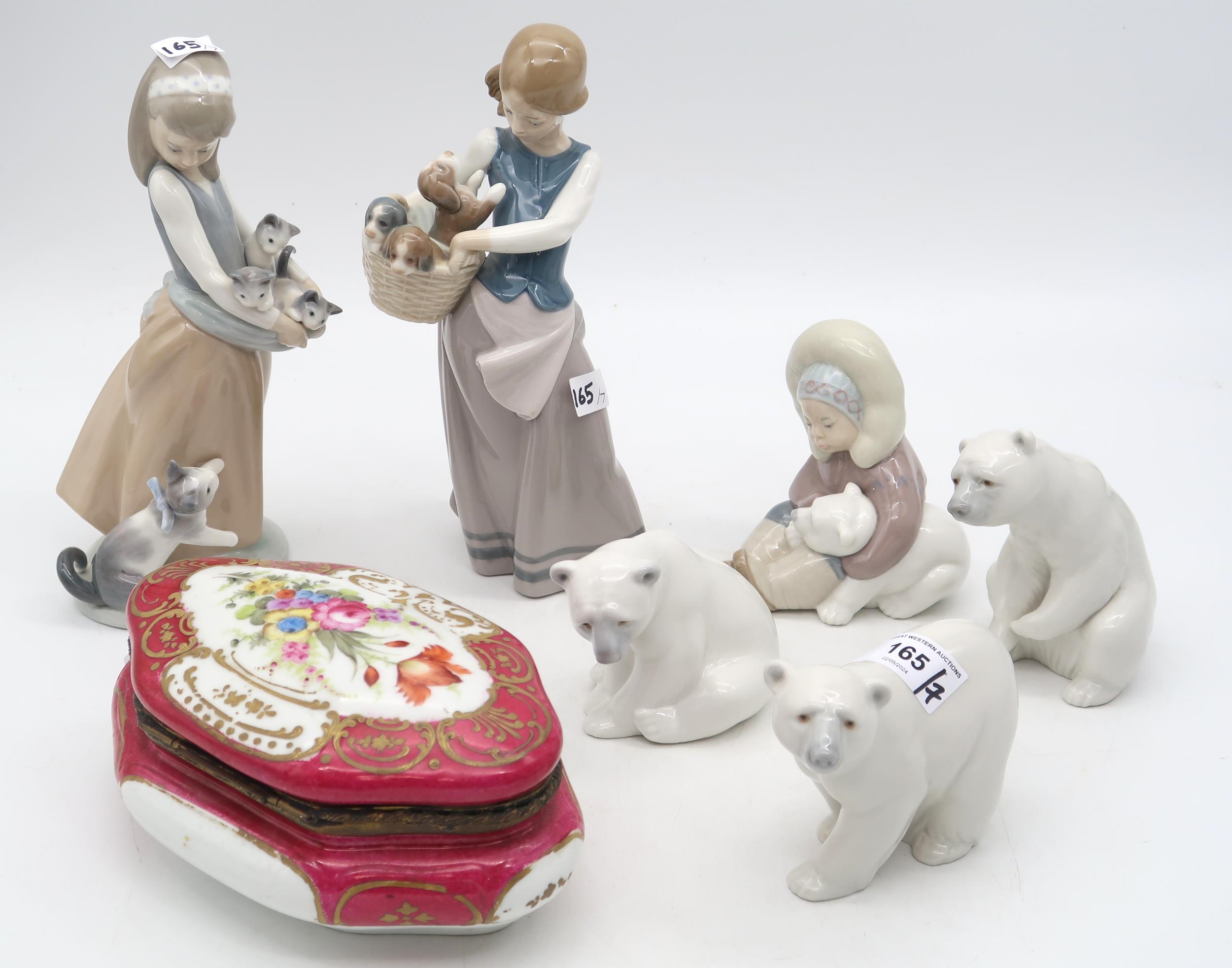 A continental porcelain box and cover together with Lladro figures of girls, an Eskimo and Polar