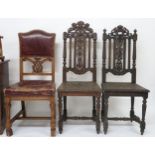 A lot comprising two assorted 19th century provincial oak hall chairs with carved backrests on