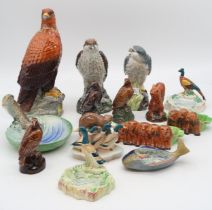 A collection of Beswick animal and birds including a trout dish, decanters, puppy ashtrays etc