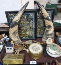 A pair of carved horns, a pair of framed hand painted thangkas, a Christmas tin, and other items