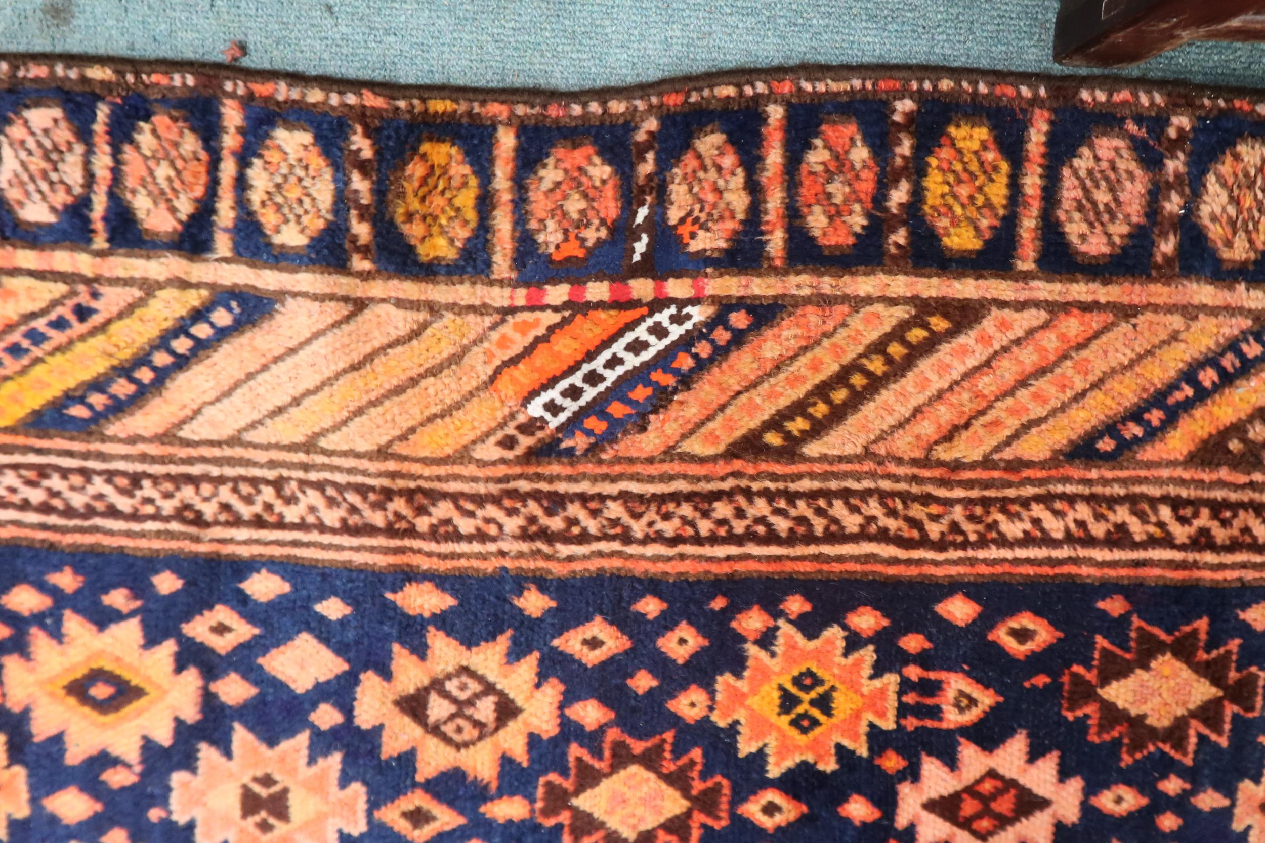 A dark blue ground Persian Qashqai rug with burnt orange geometric pattern within burnt orange - Image 3 of 3