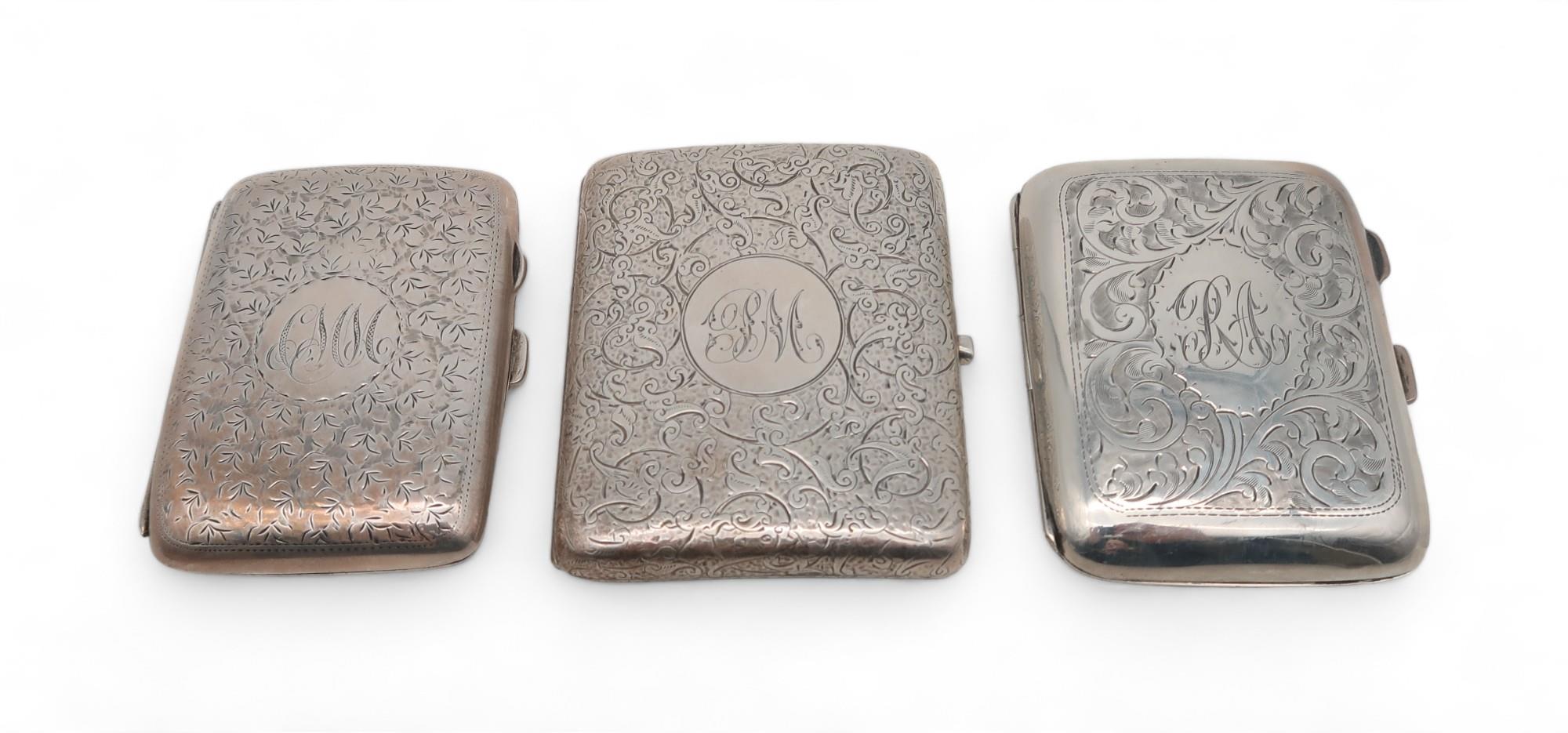 Three silver cigarette cases, one by Joseph Gloster Ltd, Birmingham, another by Deain & Francis,