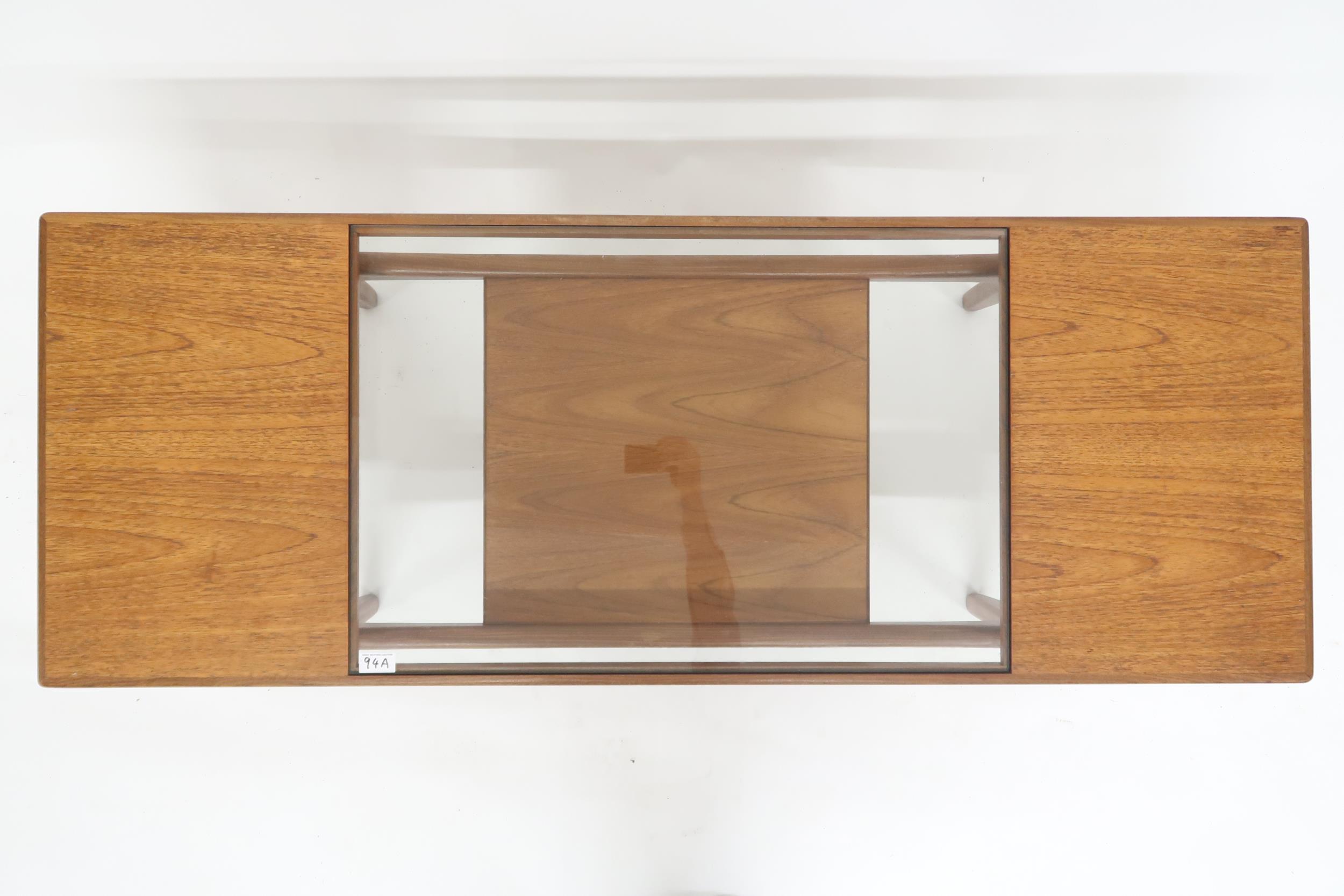 A mid 20th century G Plan teak glass topped coffee table with shaped supports joined by lower - Image 2 of 2