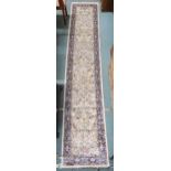 An ivory ground full pile cashmere runner with floral/foliate allover tree of life design