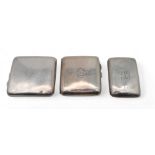 Three silver cigarette cases, one by Walker & Hall, Sheffield, another with Chester marks, and  a