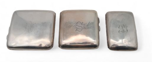 Three silver cigarette cases, one by Walker & Hall, Sheffield, another with Chester marks, and  a