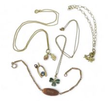 A 9ct gold Clogau gold acorn pendant, together with a 9ct gold and enamel shamrock pendant and