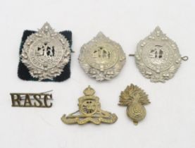 Three Argyll & Sutherland Highlanders glengarry cap badges, a Royal Artillery cap badge, Royal