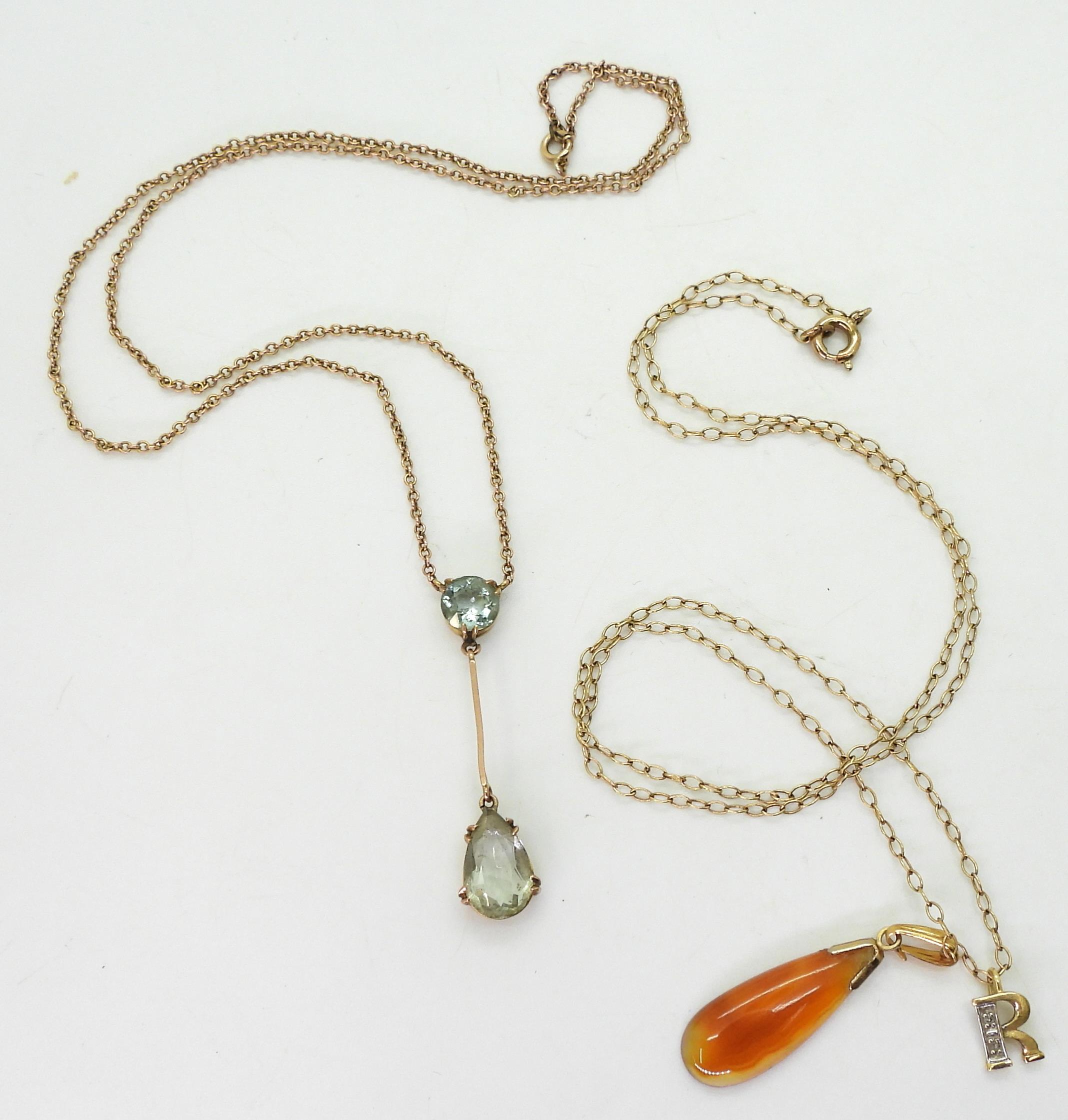 An 18ct and diamond 'R' pendant, weight 0.5gms,  9ct gold aquamarine pendant necklace, and a 9ct - Image 2 of 3
