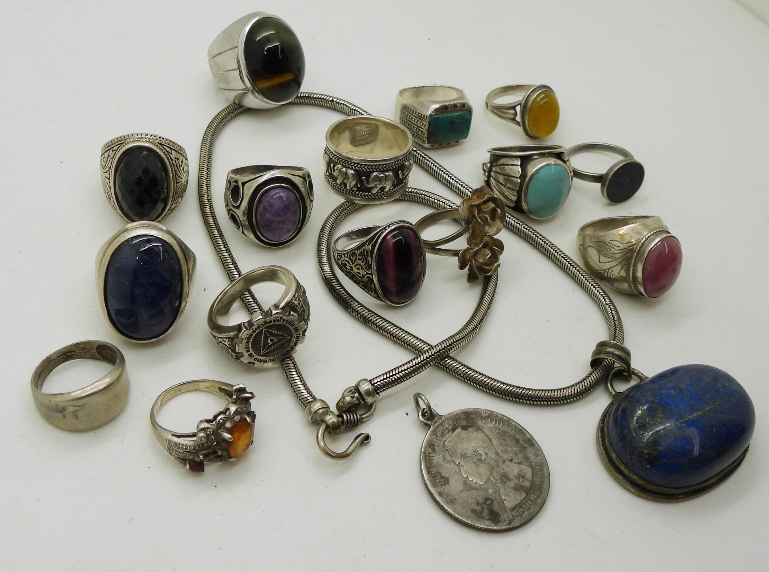 A collection of silver and white metal jewellery with a large lapis lazuli pendant, a Thai coin with - Image 2 of 5