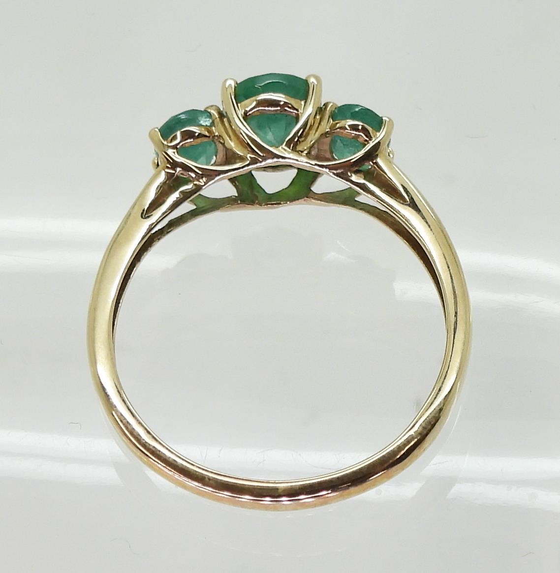 A 9ct gold emerald three stone ring, size T, weight 2.4gms Condition Report:Available upon request - Image 4 of 4
