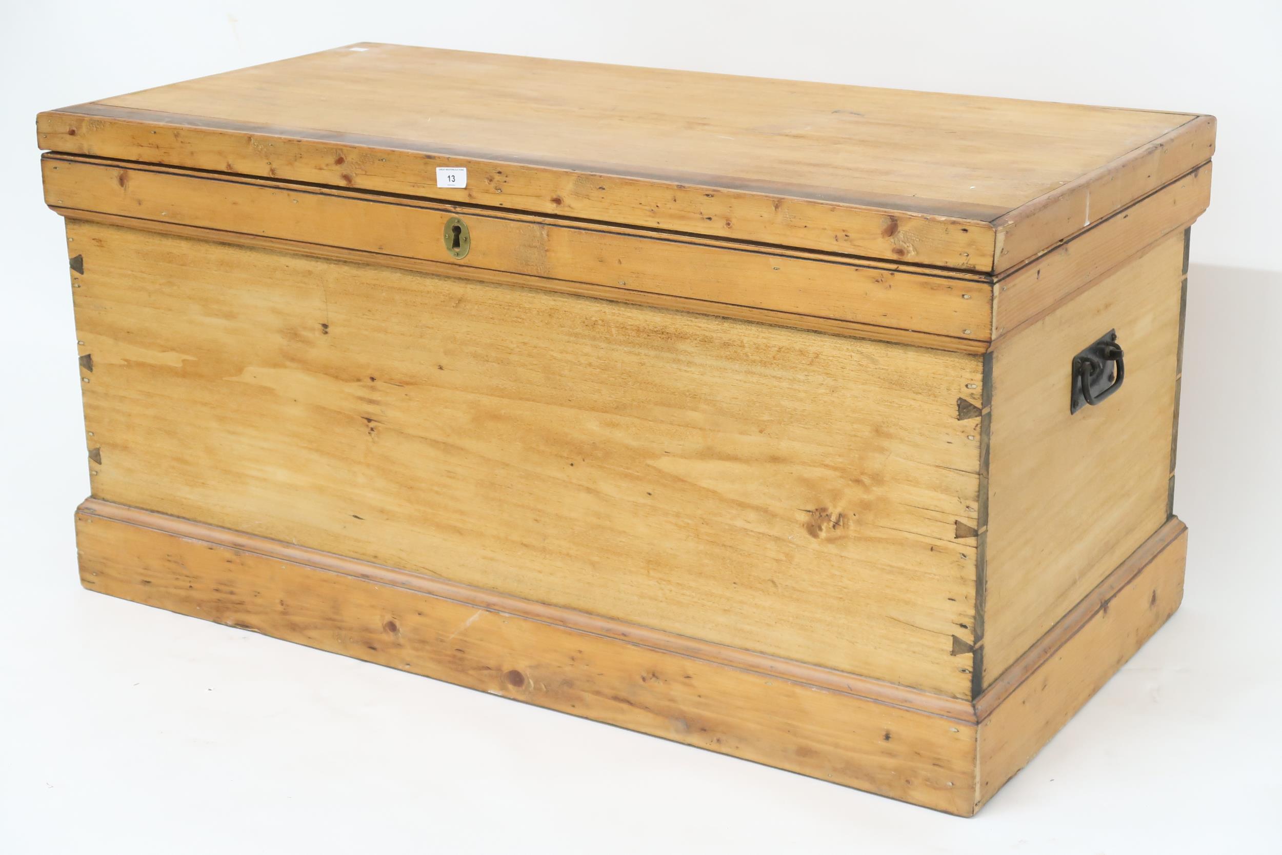 A late Victorian pine blanket chest with iron carry handles on plinth base, 62cm high x 125cm wide x - Image 2 of 3