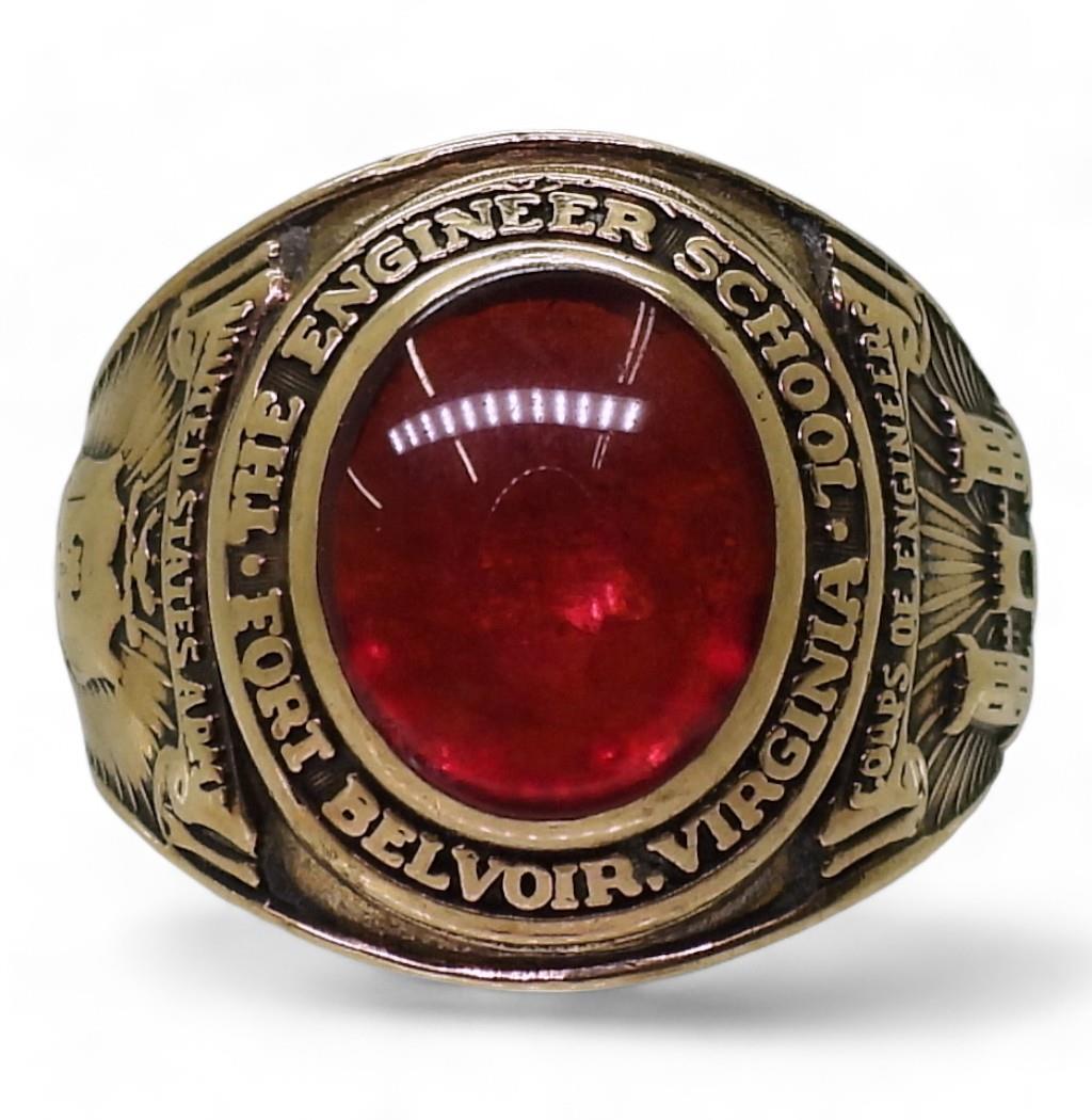 A 10k gold Balfour brand American college ring, set with a red glass gem, for The Engineer School,