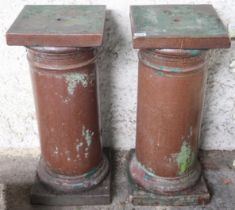 A pair of 20th century stoneware garden pedestals with square tops on cylindrical columns on