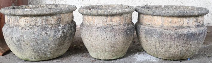 A lot comprising a pair of 20th century reconstituted stone garden urns, 32cm high x 47cm diameter