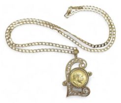 A 1903 gold half sovereign in a 9ct gold filigree Pound sign shaped pendant mount on a 60cm 9ct gold