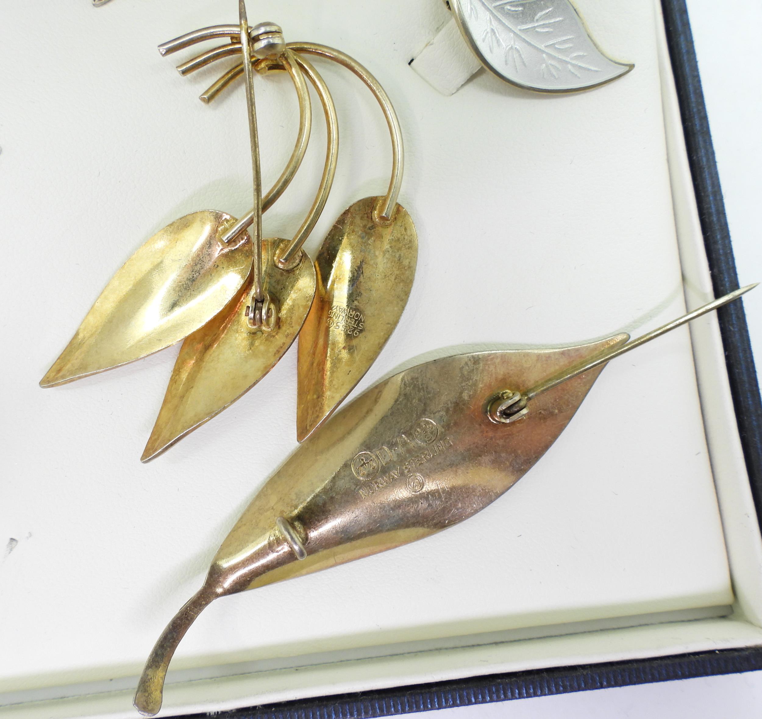 A collection of silver gilt  Norwegian enamel jewellery to include a white leaf brooch and - Image 5 of 6