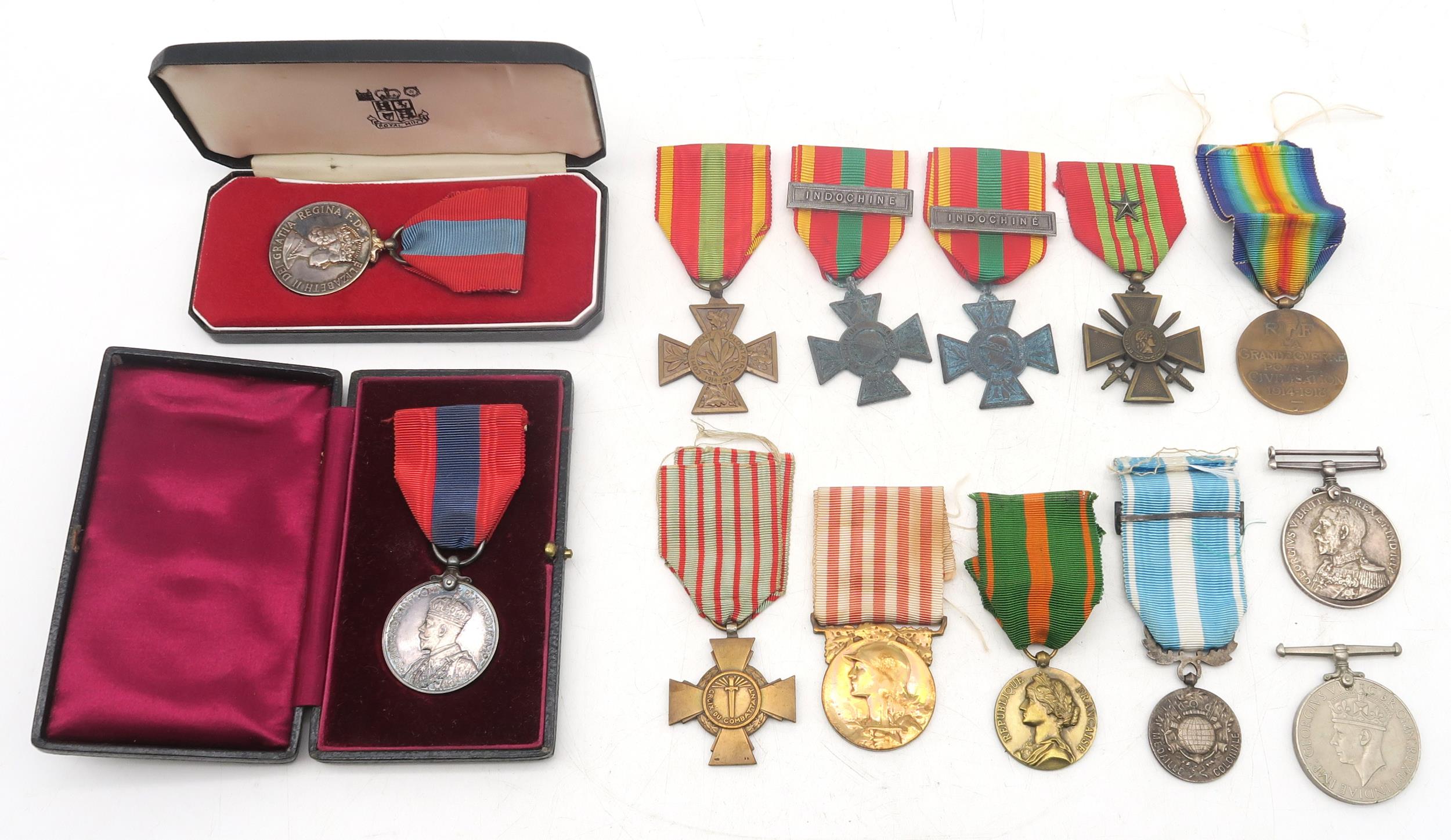 A George V Imperial Service Medal awarded to John Goldie, and an Elizabeth II example awarded to