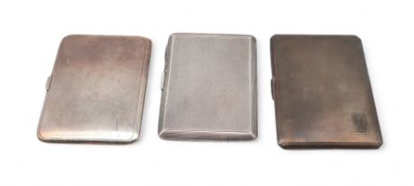 Three silver cigarette cases, one by Mappin & Webb, Birmingham, all with engine-turned decoration,