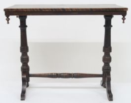 A late Victorian mahogany hall table with rectangular top on turned supports on out swept feet