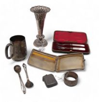 A collection of silver including a pair of Georg Jensen spoons, a silver christening mug by Martin