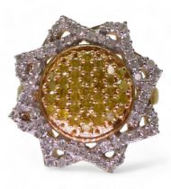A 9ct gold yellow and white diamond sunflower ring, size J1/2, weight 3gms Condition Report: