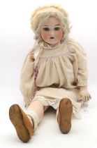 A large Armand Marseilles doll with articulated limbs, marked to the back of the head "Germany, 390,