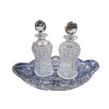 An extensively cut crystal dish, together with a pair of decanters Condition Report:Available upon