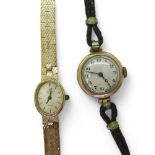 A 9ct gold ladies Marvin revue watch with integral strap and a ladies vintage 9ct gold watch head,