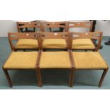 A set of six mid 20th century teak Nathan dining chairs with shaped pierced splats over