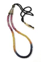 Rainbow sapphire beads each faceted bead is strung in a multi string twisted necklace with